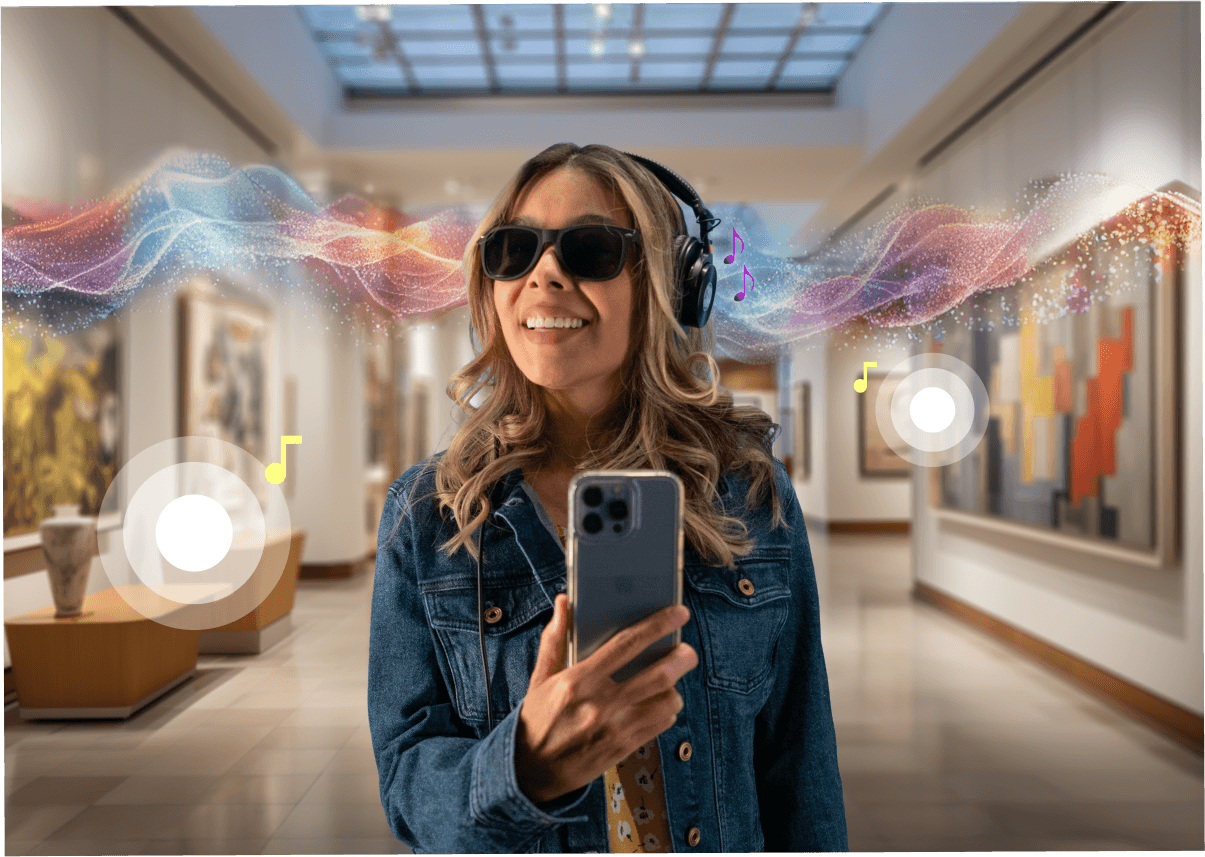 headphones smiles while holding a smartphone in an art gallery, surrounded by colorful abstract light waves and musical note icons that represent an audio-based augmented reality experience for the visually impaired.